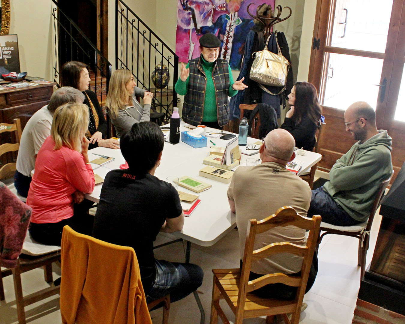 Group gathered around table for book discussion