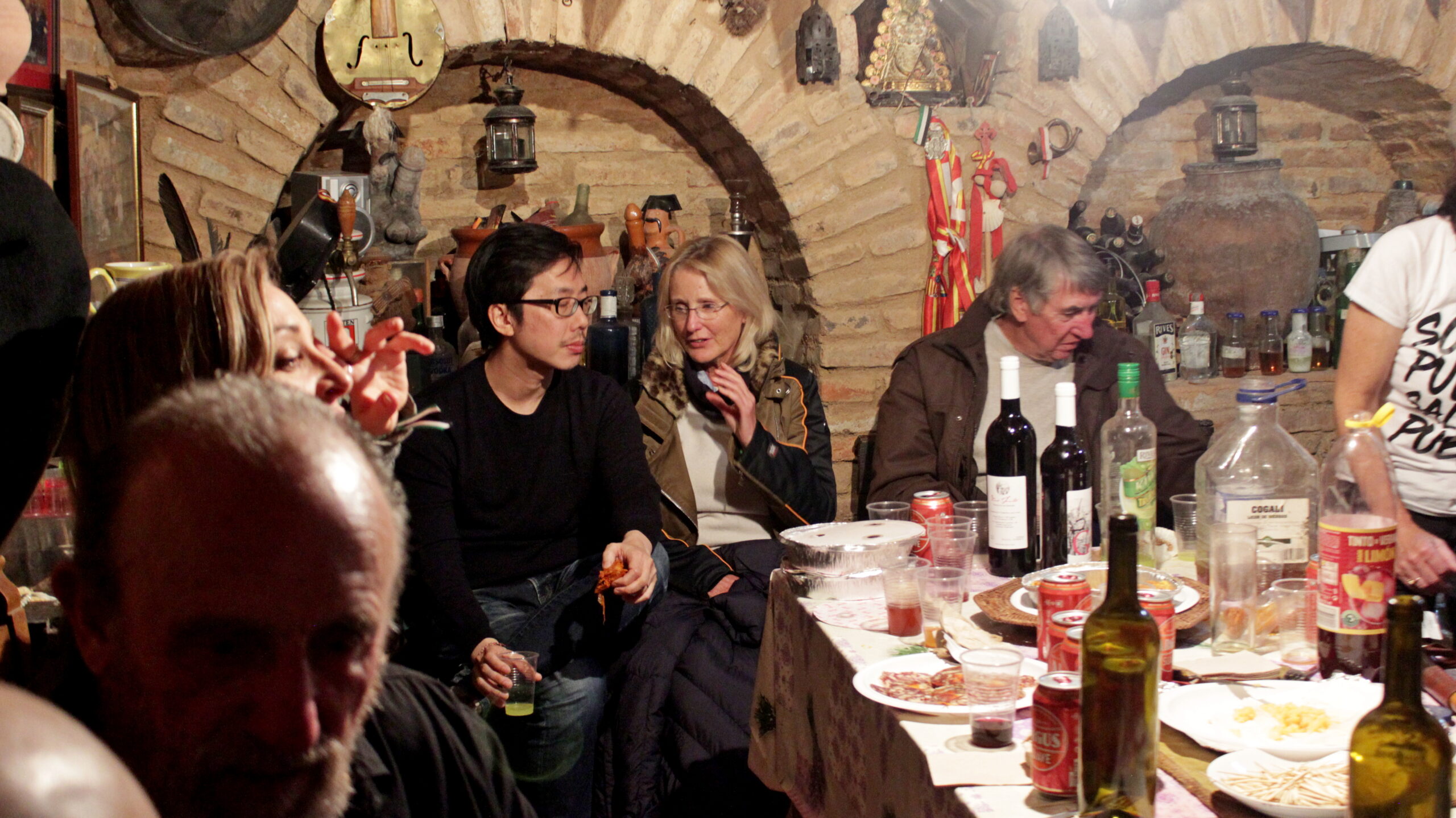 Students enjoying a meal together in a rustic dining room