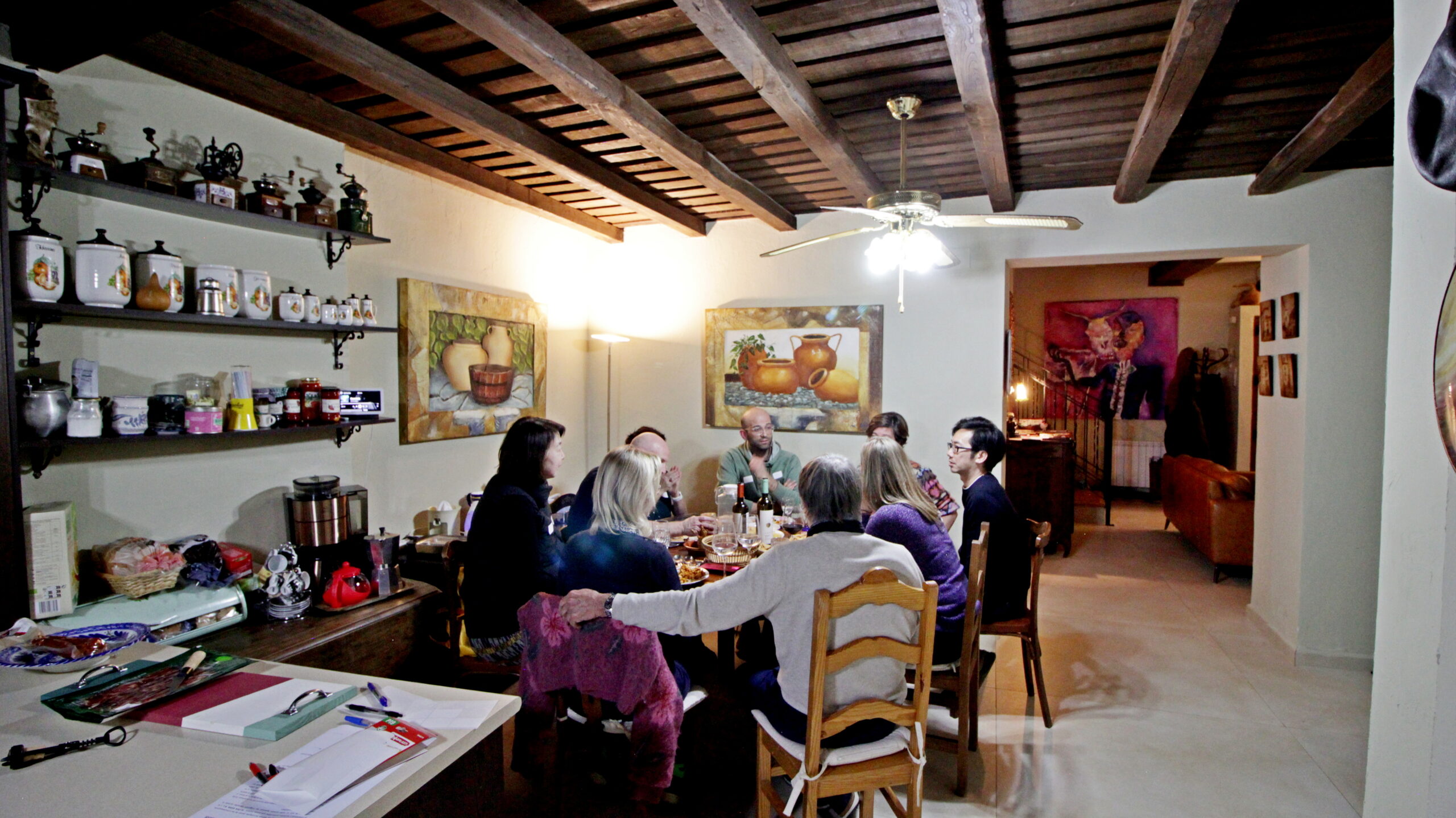 Retreat group sharing a meal around the dining table