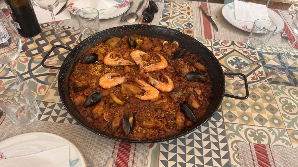 Seafood paella served at the table